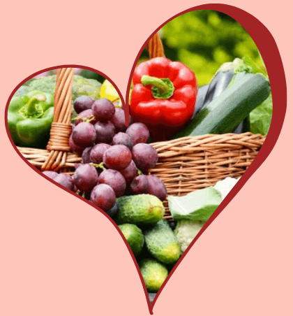 Heart-shaped collage of vegetables and fruits.