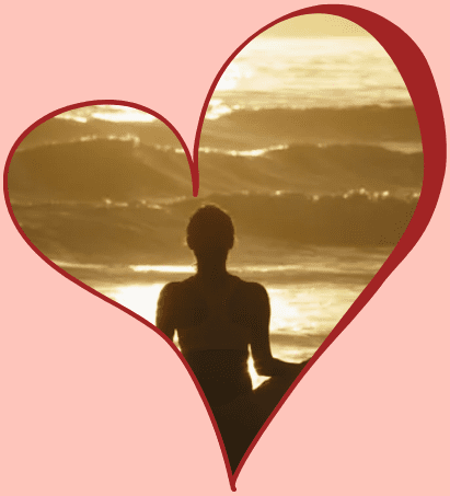 Silhouette meditating by ocean at sunset.